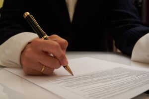 probate lawyer Montgomery County, PA with a man signing a document